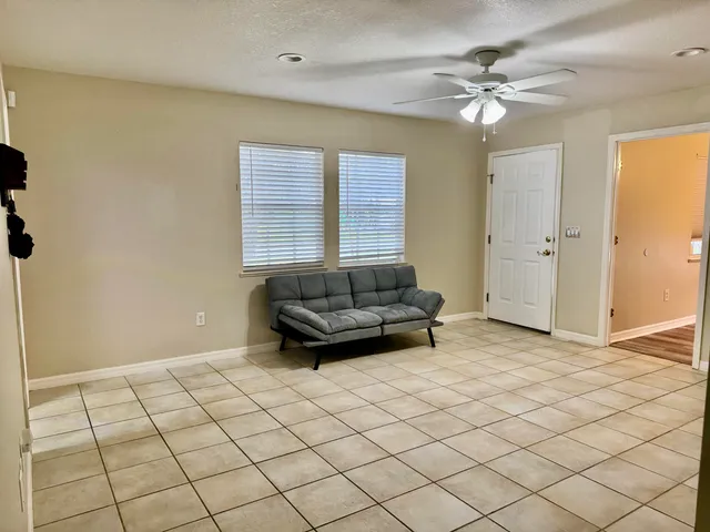 a kitchen with a stove a refrigerator and cabinets