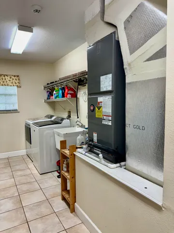 a room with storage and a shelf