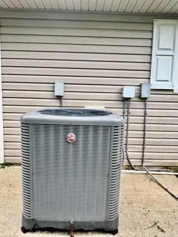a view of a backyard with plants and a patio