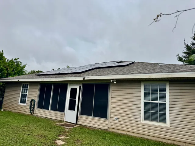 a view of a house with backyard and garden