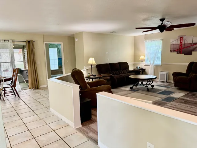 a living room with furniture and a table