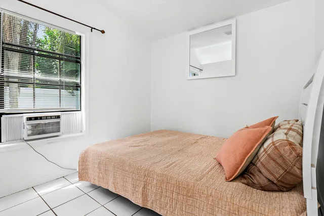 a bathroom with a sink vanity mirror and toilet