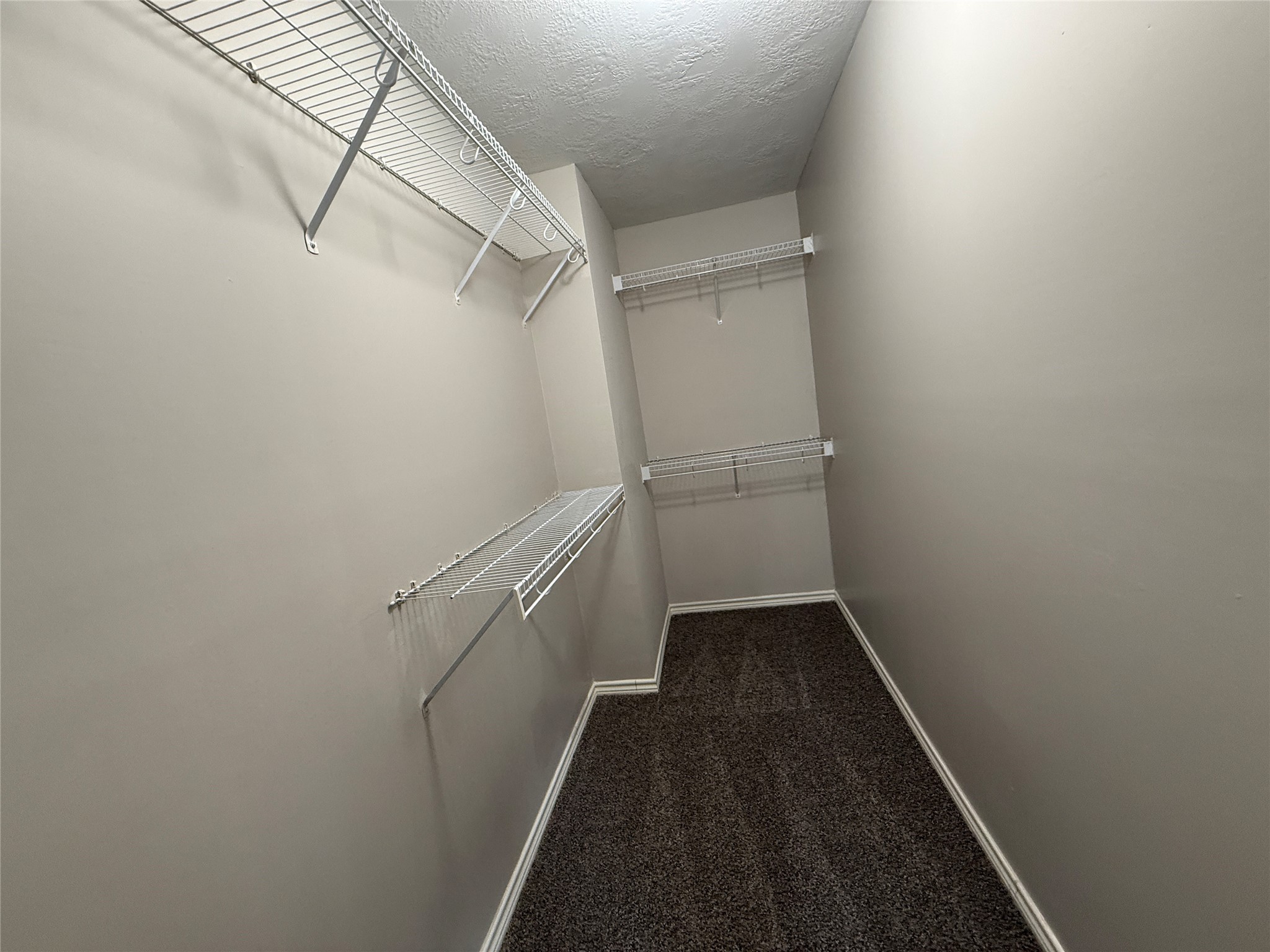 2325 Shady Tree Lane Conroe, TX 77301 - Photo 11 of 22 a view of a room with racks on the wall