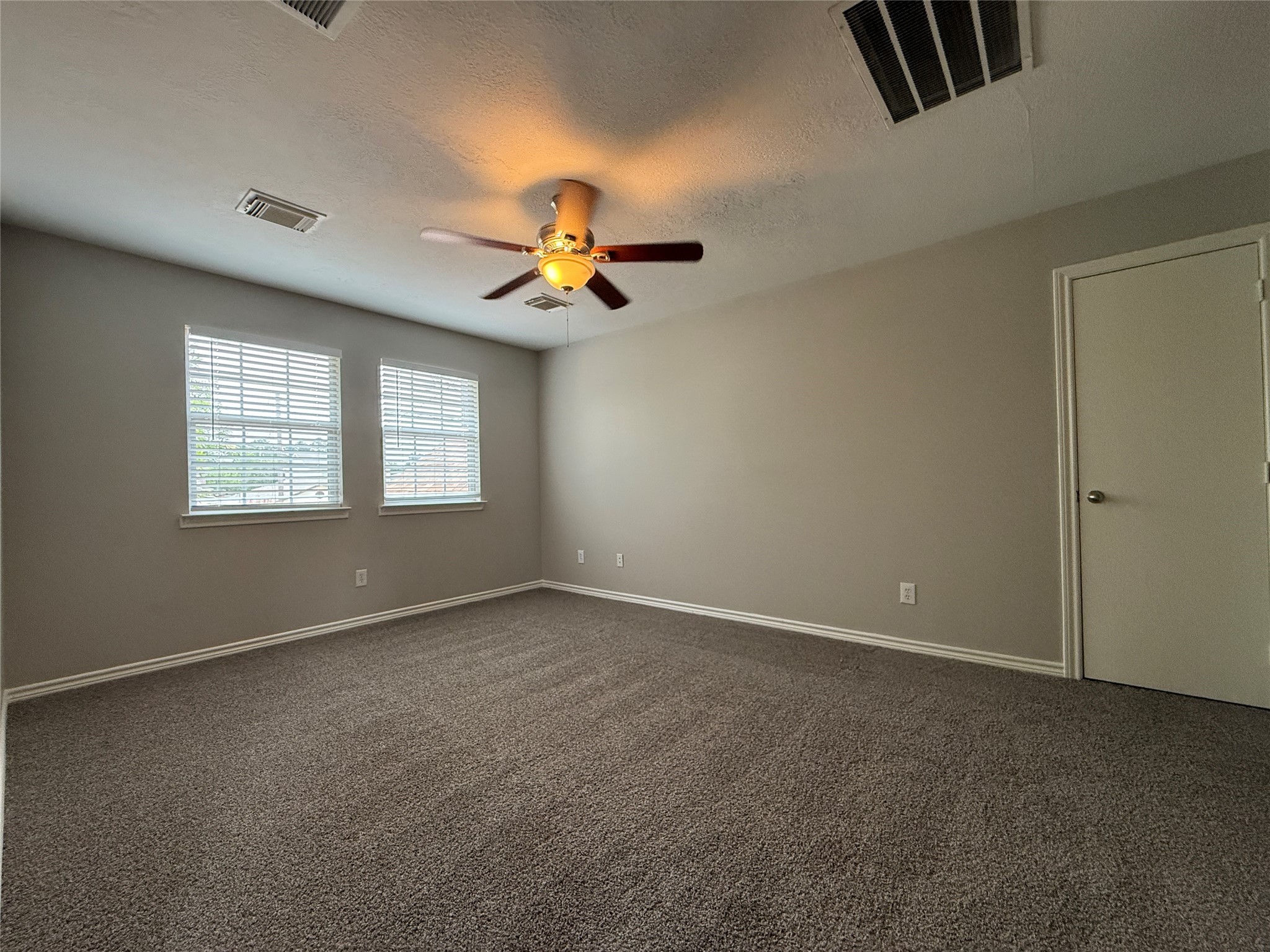 2325 Shady Tree Lane Conroe, TX 77301 - Photo 13 of 22 a view of an empty room with a window