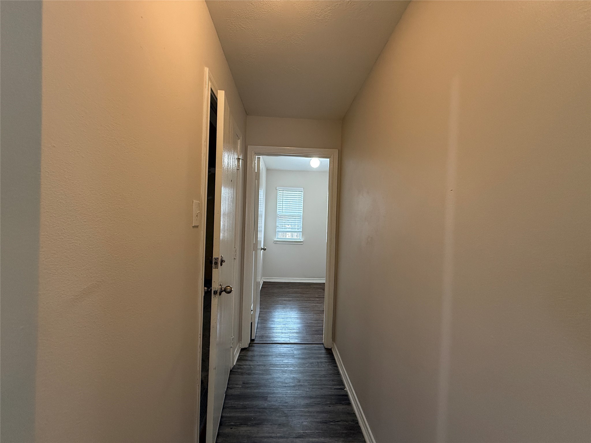 2325 Shady Tree Lane Conroe, TX 77301 - Photo 17 of 22 a view of a hallway with wooden floor
