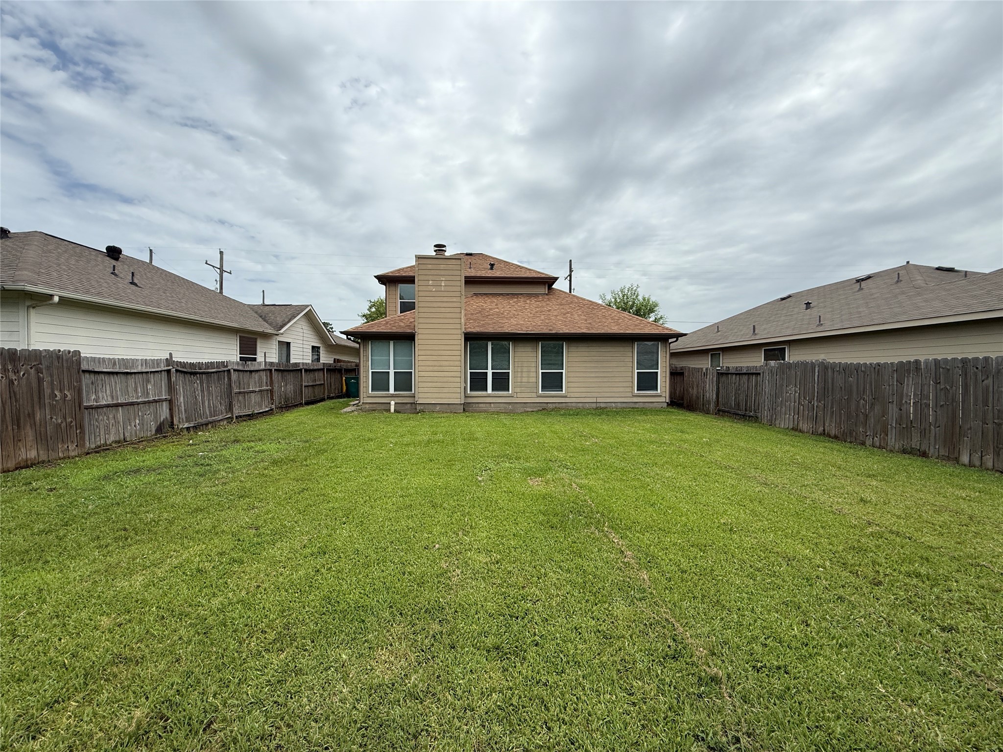 2325 Shady Tree Lane Conroe, TX 77301 - Photo 2 of 22 a view of a house with a back yard