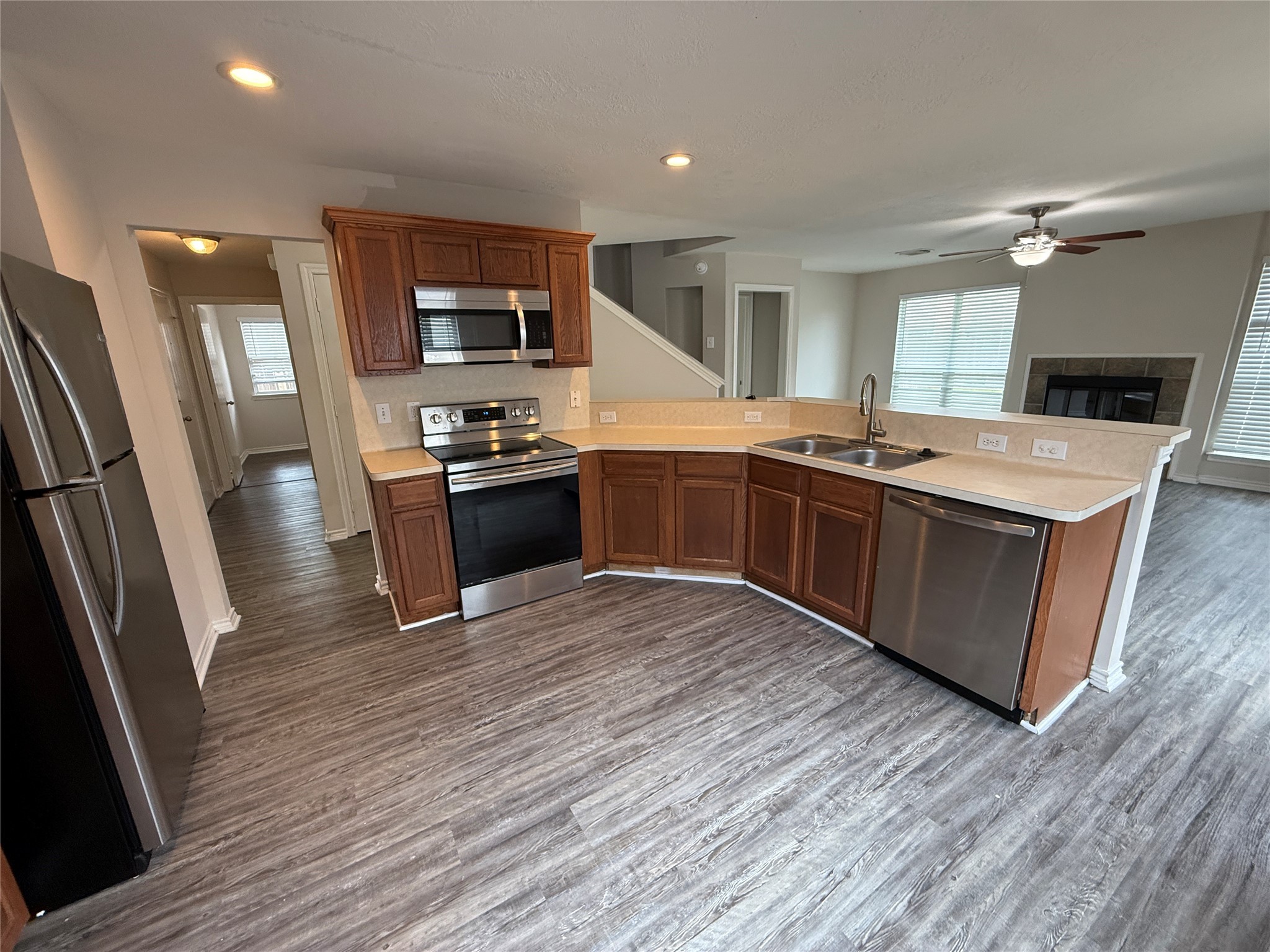 2325 Shady Tree Lane Conroe, TX 77301 - Photo 5 of 22 a large kitchen with stainless steel appliances granite countertop a stove and a sink