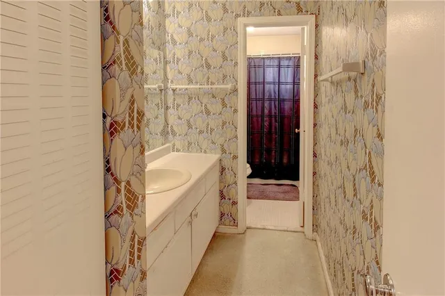 a bathroom with a sink and a mirror