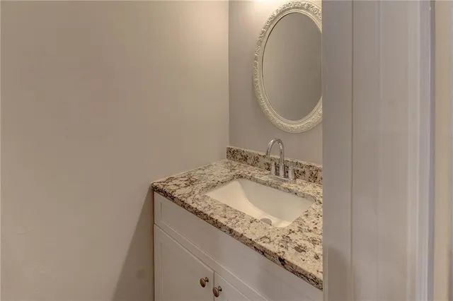 a kitchen with a stove a sink and a refrigerator