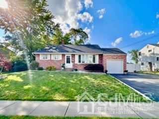 57 Eardley Road Edison, NJ 08817 - Photo 1 of 33 a front view of a house with a yard and garage