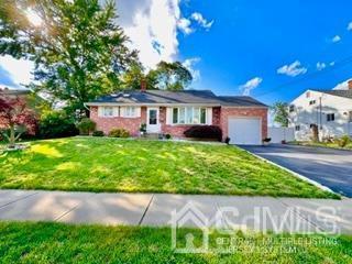 57 Eardley Road Edison, NJ 08817 - Photo 5 of 33 a front view of a house with garden