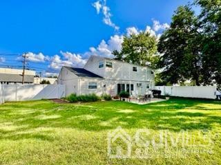 57 Eardley Road Edison, NJ 08817 - Photo 8 of 33 a view of a house with a big yard potted plants and large tree
