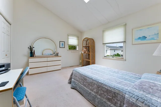 a bedroom with bed and window