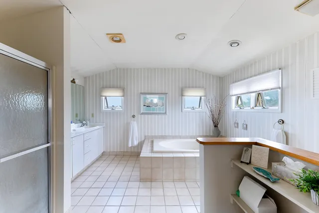 a bathroom with a sink a mirror and a bathtub