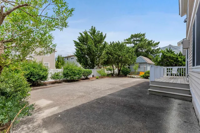 a view of backyard with a garden and deck
