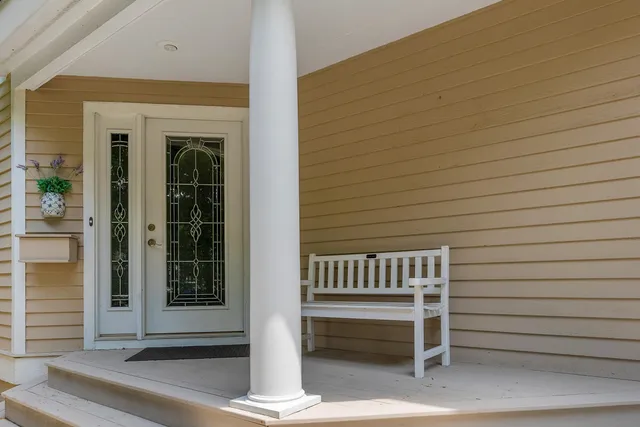 a view of porch with a bench