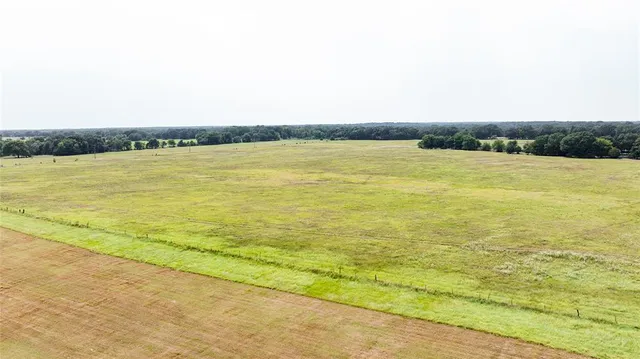 a view of an swimming pool and a yard