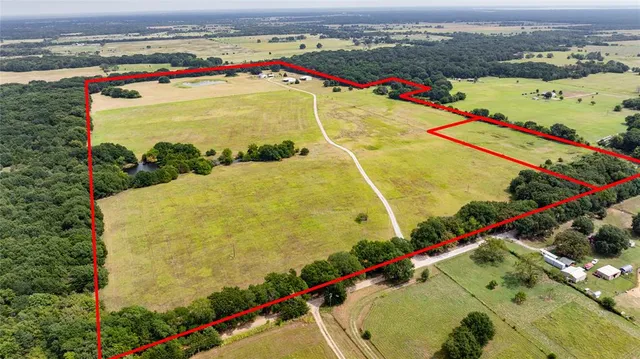 a kitchen with lots of counter top space and painting on the wall