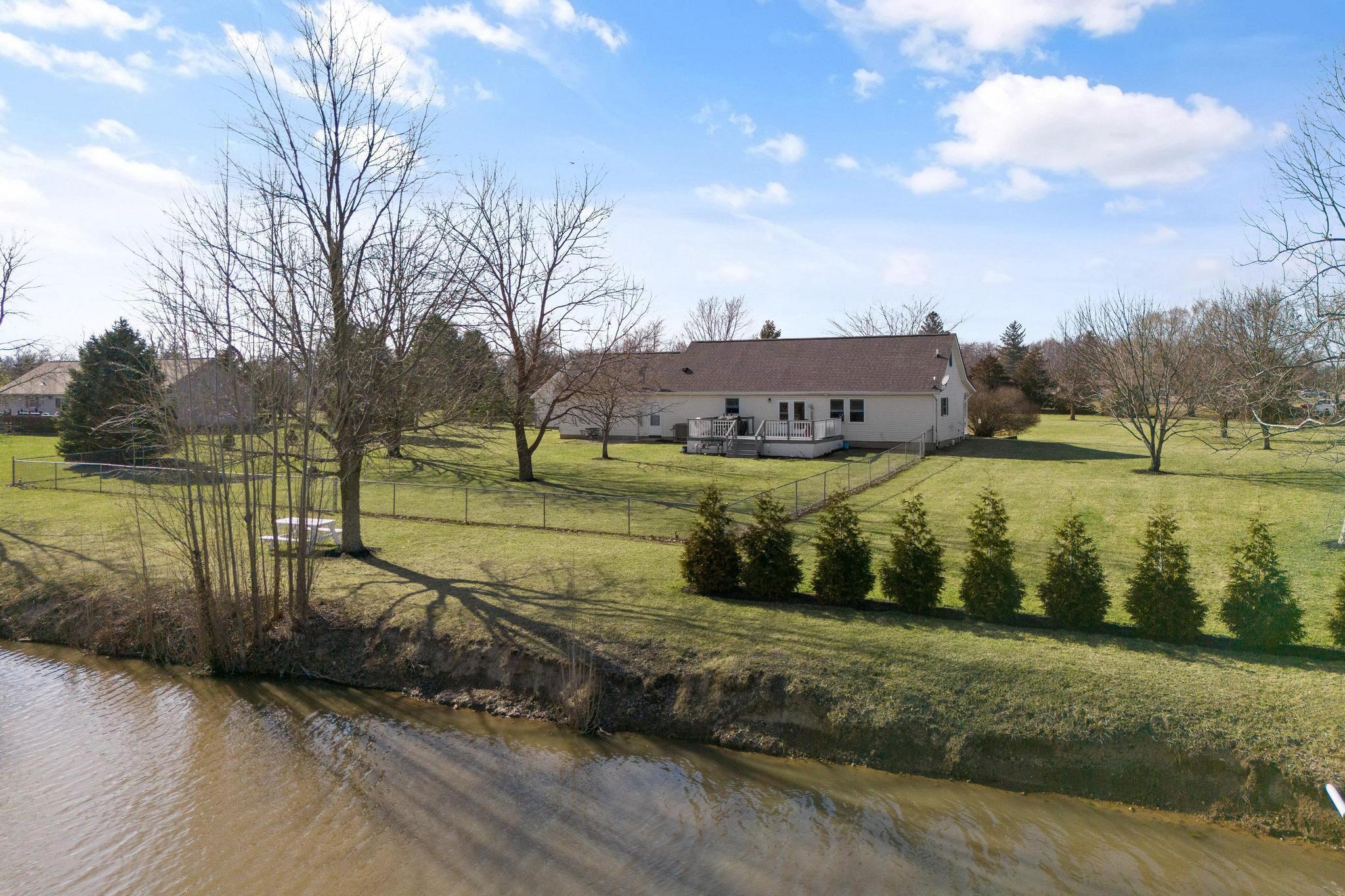 75 South State Rte 72 Sabina, OH 45169 - Photo 46 of 48 rear of home deck and pond view