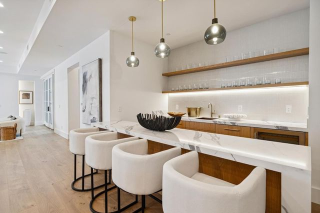 a view of a fountain with a bench in the patio