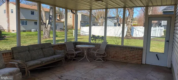 a balcony with furniture and a garden