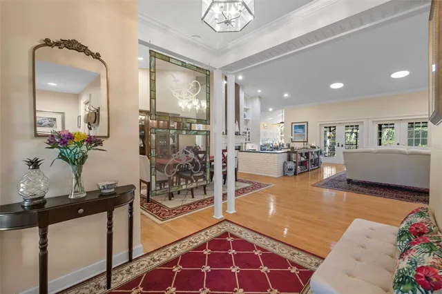 a dining room with furniture and wooden floor