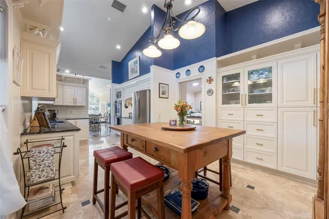 a living room with furniture and painting on the wall