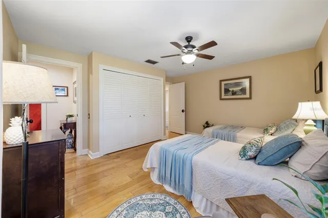 a view of a wooden chair and table with chairs in patio