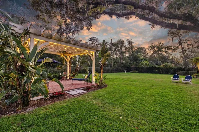 a living room with furniture and a dining table with kitchen view