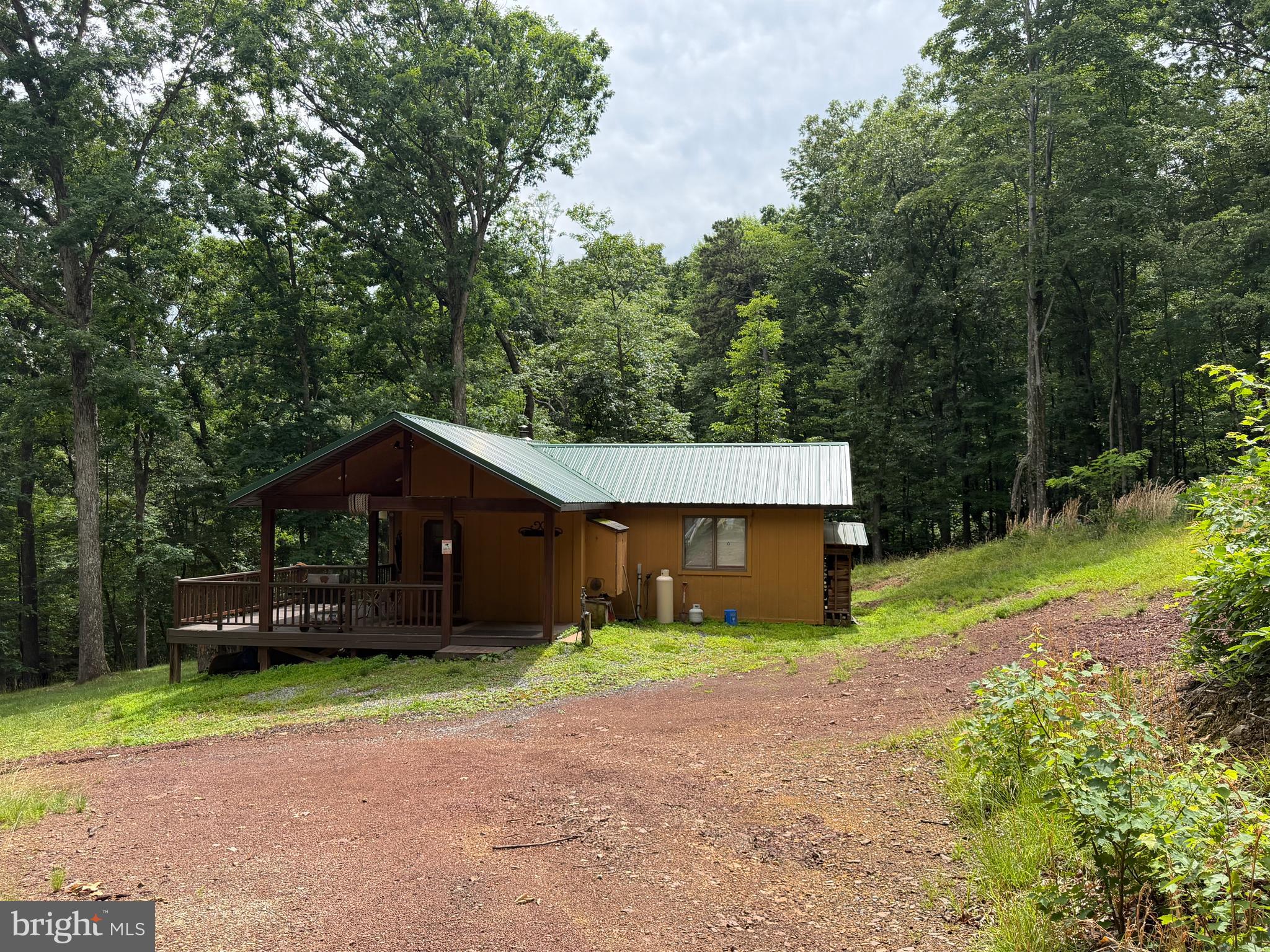 1419 Paul's Woods Road Delray, WV 26714 - Photo 71 of 105 a front view of a house with a yard and garage