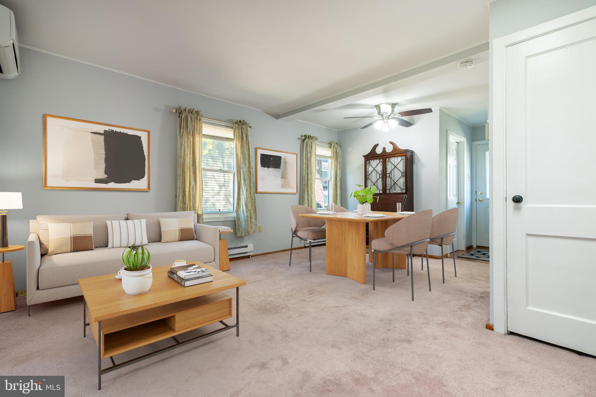 Open dining/living room . Virtually staged