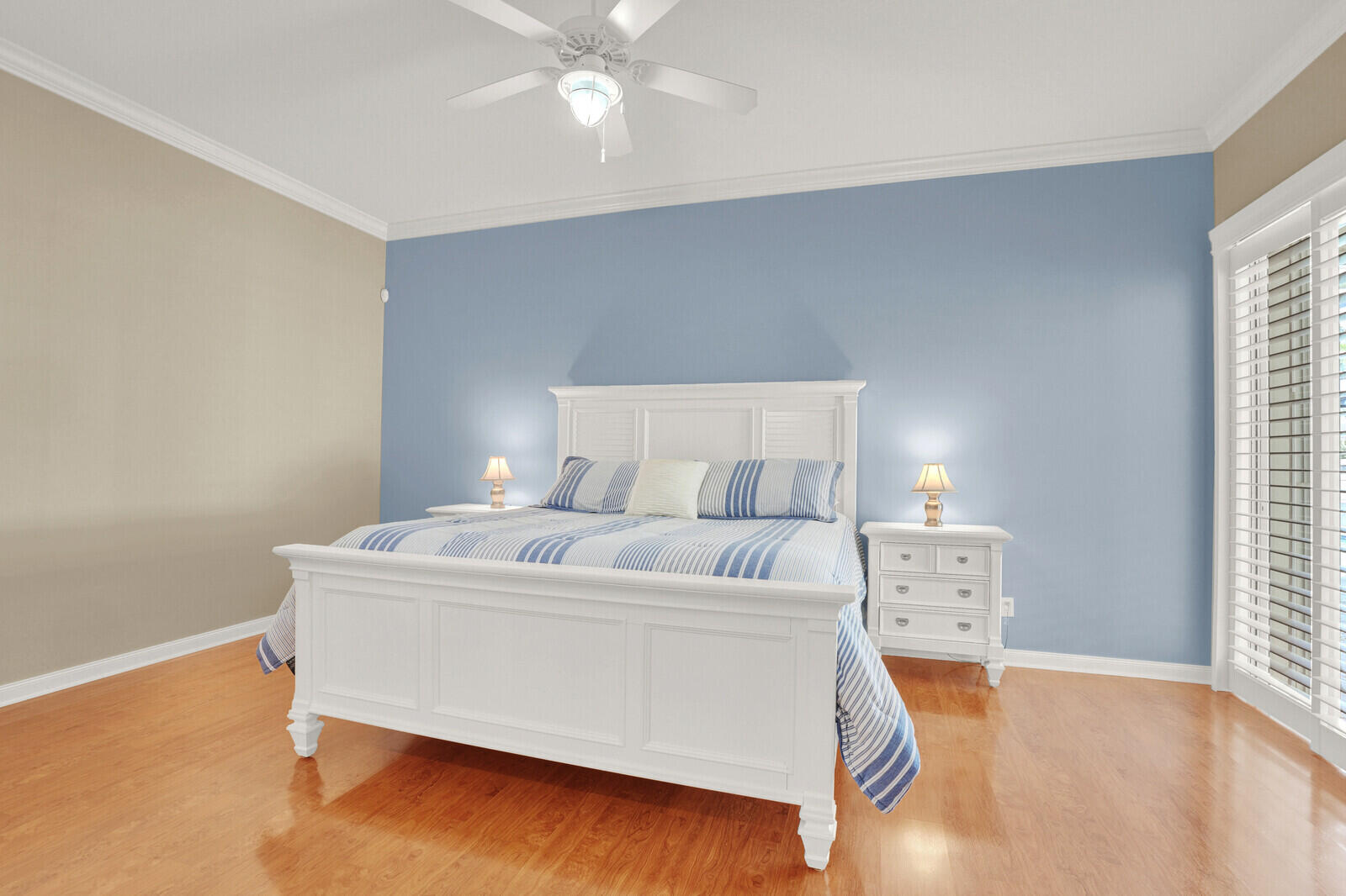 2688 East Community Drive Jupiter, FL 33458 - Photo 23 of 50 a bedroom with a bed and a night stand
