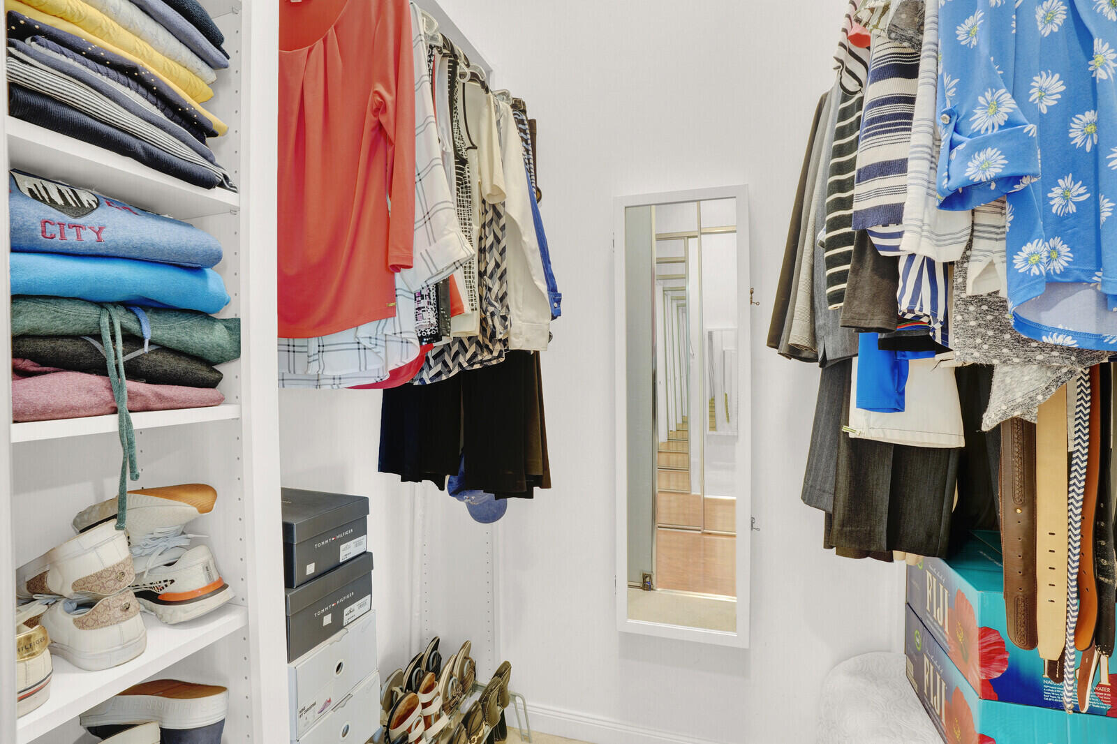 2688 East Community Drive Jupiter, FL 33458 - Photo 26 of 50 a view of walk in closet with clothes and shoes