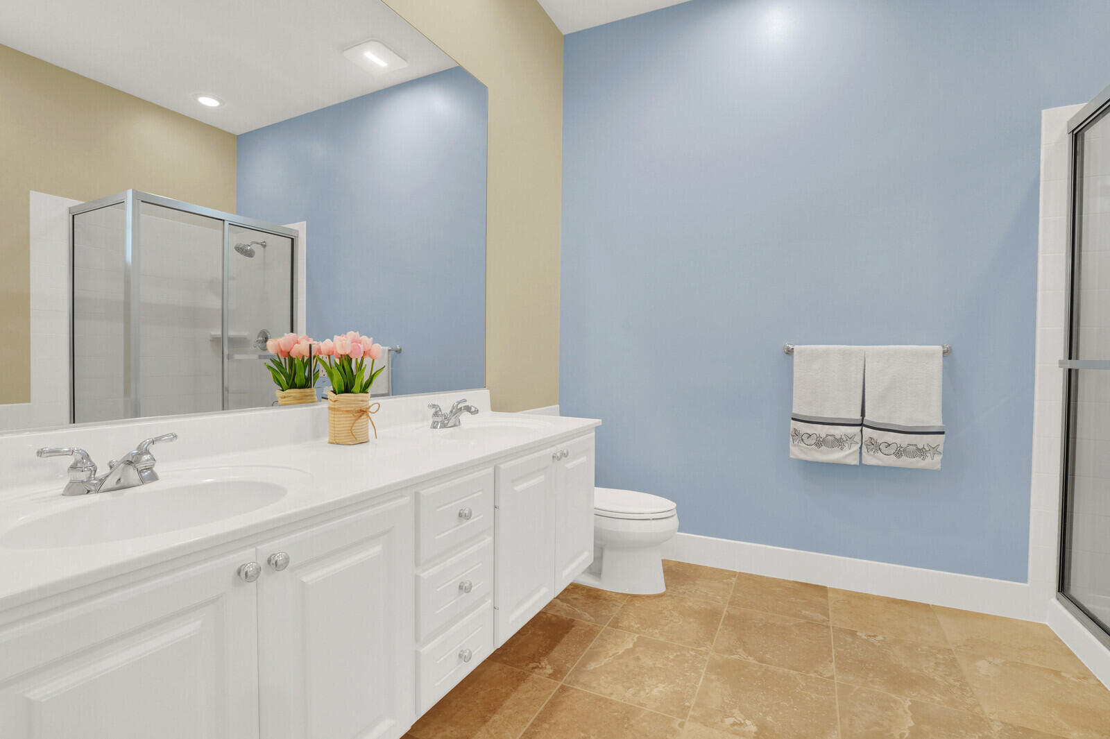 2688 East Community Drive Jupiter, FL 33458 - Photo 27 of 50 a bathroom with a sink a toilet and mirror