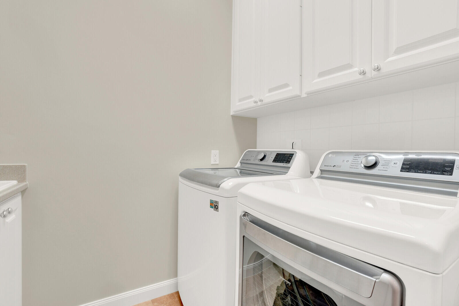2688 East Community Drive Jupiter, FL 33458 - Photo 30 of 50 a utility room with dryer and washer