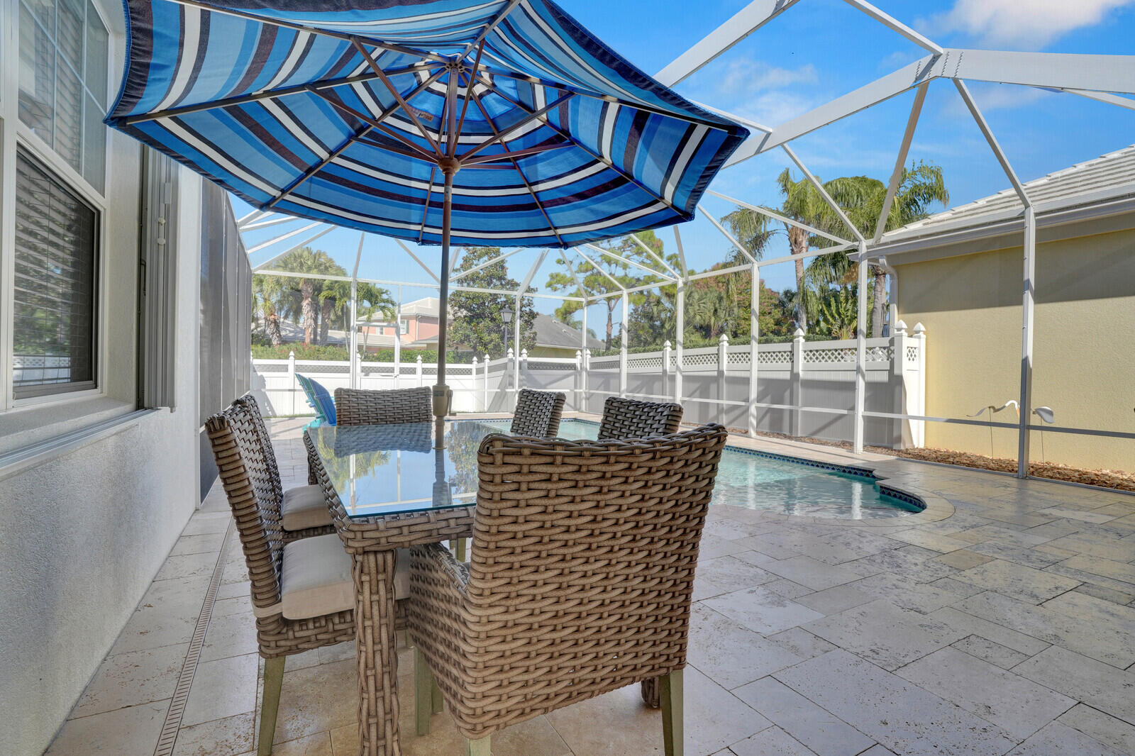2688 East Community Drive Jupiter, FL 33458 - Photo 38 of 50 a view of a chairs and table in the patio