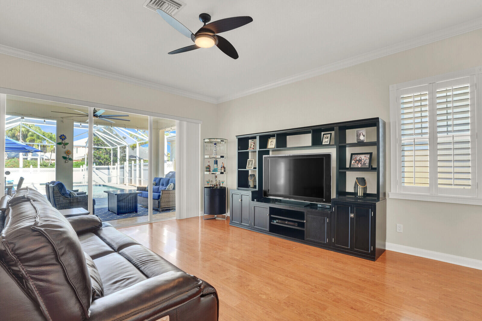 2688 East Community Drive Jupiter, FL 33458 - Photo 8 of 50 a living room with furniture and a flat screen tv