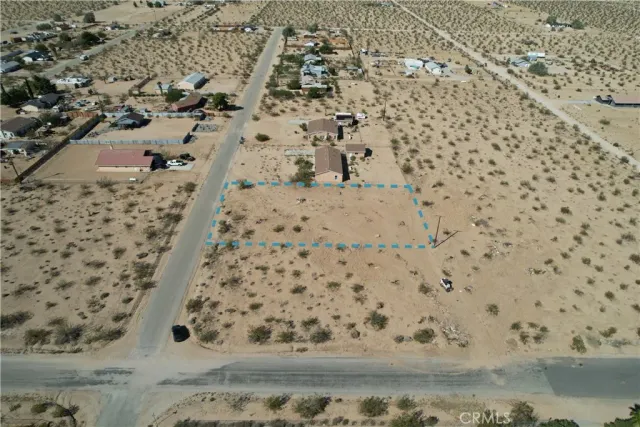 an aerial view of residential houses with parking space