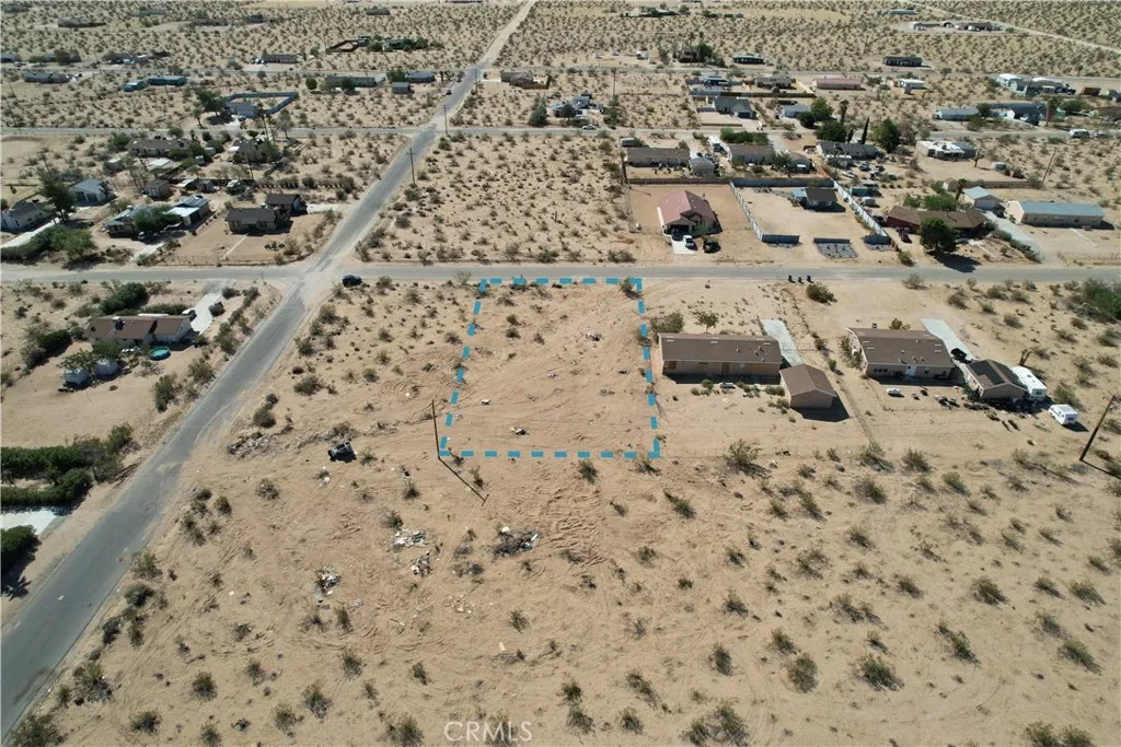 63480 Walpi Joshua Tree, CA 92252 - Photo 4 of 13 an aerial view of residential houses with parking space