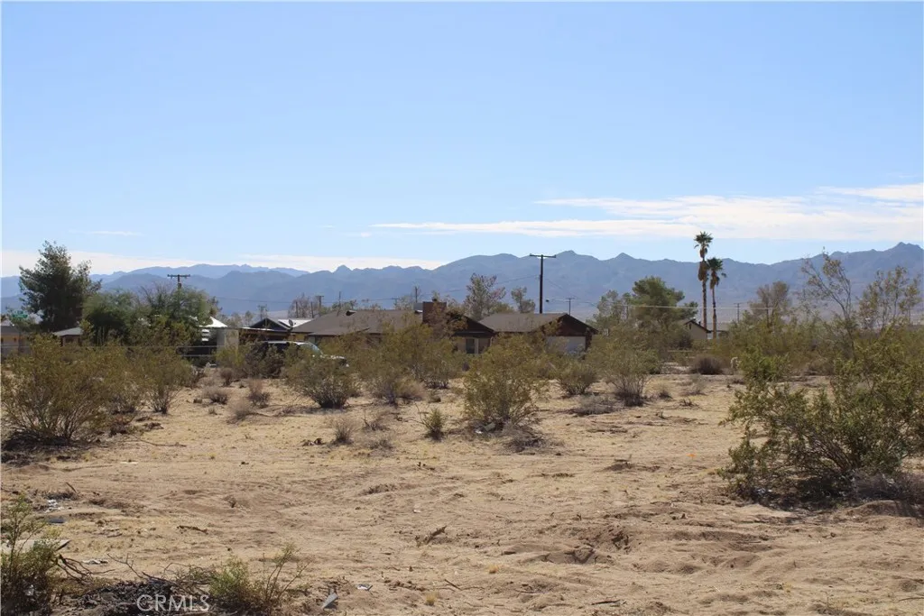 63480 Walpi Joshua Tree, CA 92252 - Photo 8 of 13 a view of a lake with mountains in the background