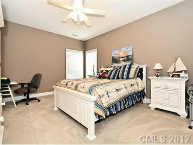 16621 Turtle Point Road Charlotte, NC 28278 - Photo 12 of 16 a spacious bedroom with a bed and furniture