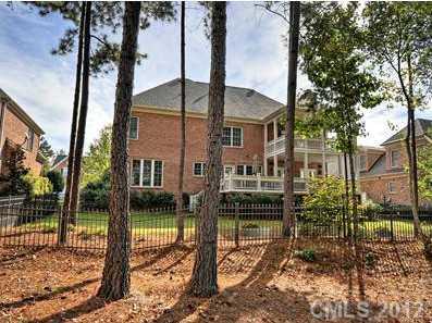 16621 Turtle Point Road Charlotte, NC 28278 - Photo 15 of 16 a view of a house with backyard and trees