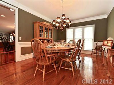 16621 Turtle Point Road Charlotte, NC 28278 - Photo 5 of 16 a view of a dining room with furniture window and wooden floor