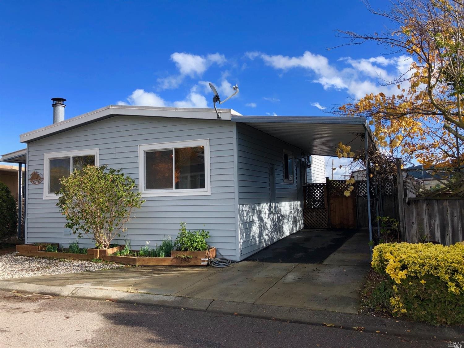 115 Bryce Canyon Road, Unit 115 San Rafael, CA 94903 - Photo 1 of 1 a front view of a house with a yard
