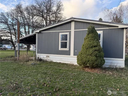 a backyard of a house with lots of green space