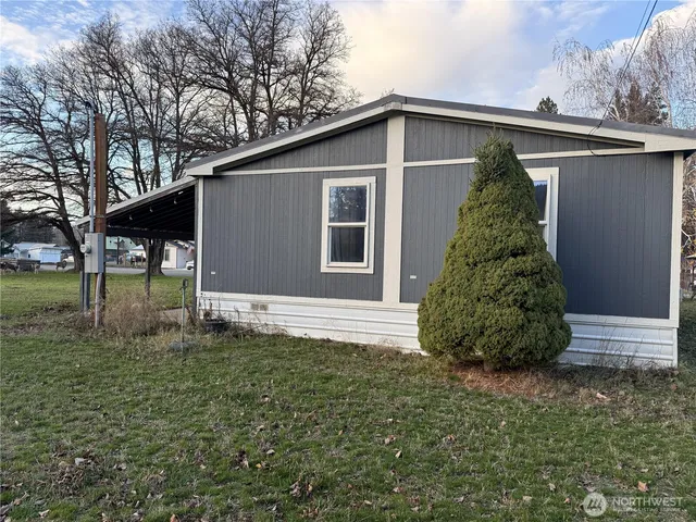a backyard of a house with lots of green space