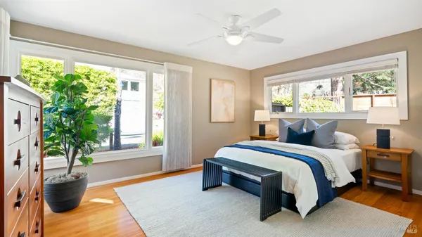 a spacious bedroom with a bed and window