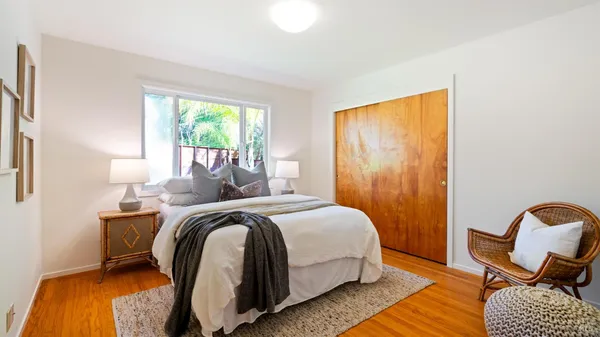 a bathroom with a granite countertop sink a toilet and bathtub