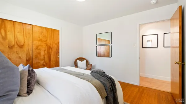 a bathroom with a granite countertop sink a toilet and bathtub