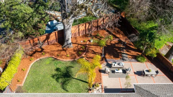 a view of a house with swimming pool and sitting area